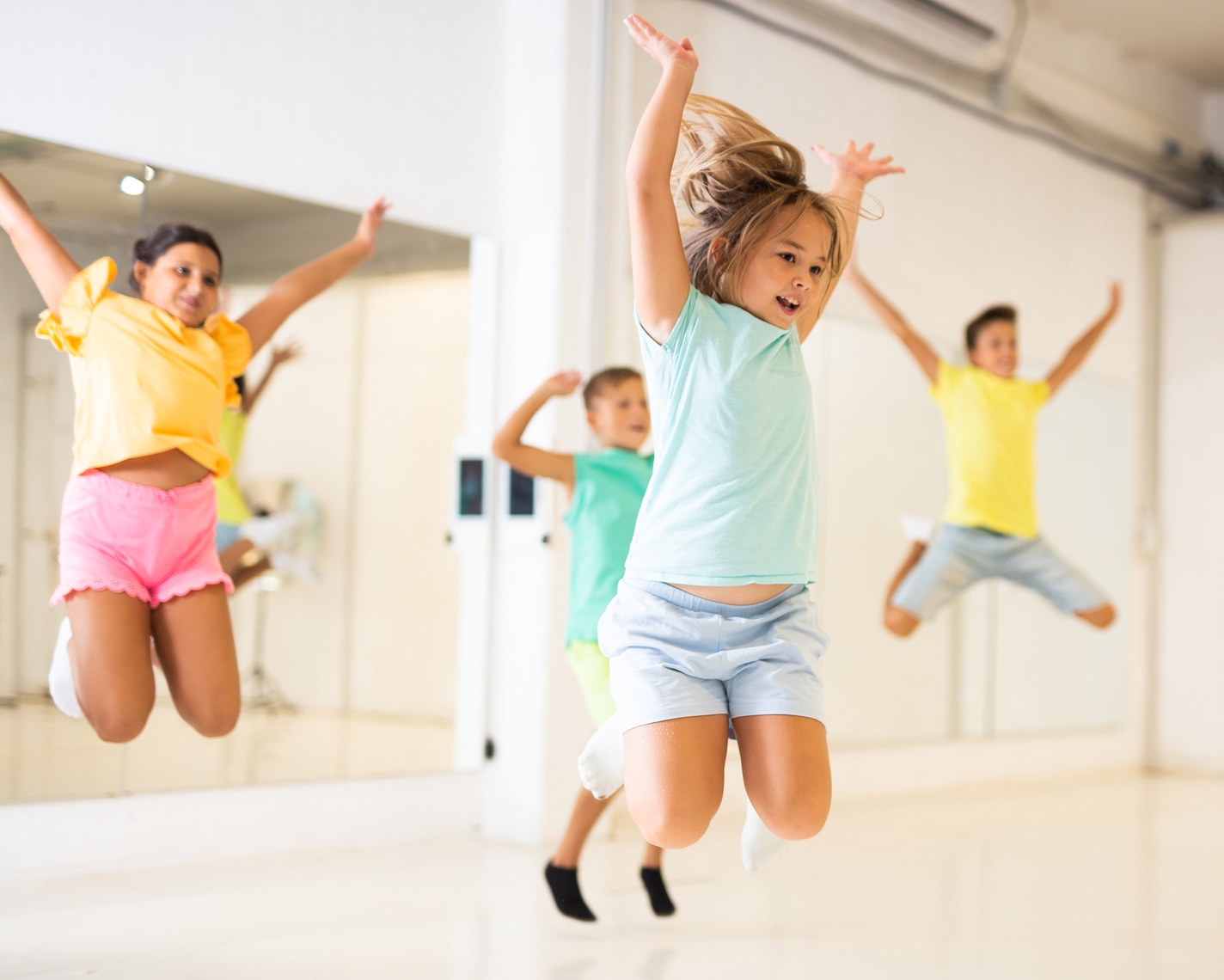 Kids jumping in dance studio